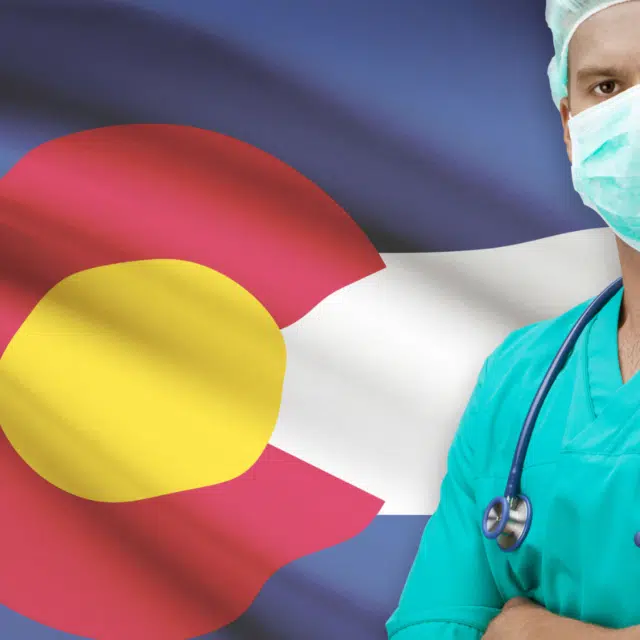 Surgeon with USA states flags on background - Colorado