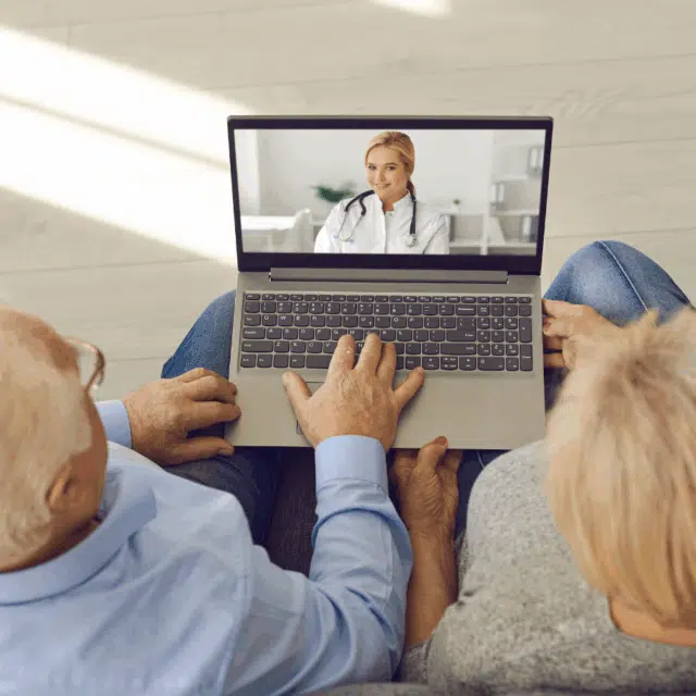 How Does Telehealth Help Older Primary Care Patients? Feature Image: Older couple in a teleheatlh session