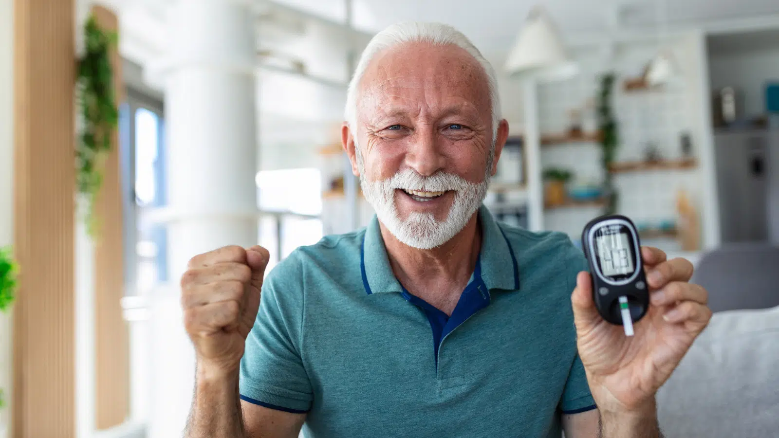 Managing Diabetes in Older Adults Feature Image: Senior man checking blood sugar level by glucometer and test stripe at home
