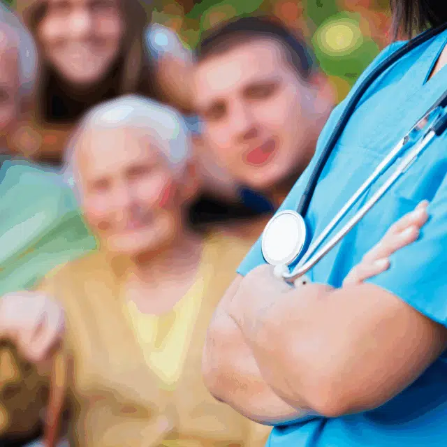 Tips for Caregivers and Families of People With Dementia Feature Image: A woman with dimentia being seen by a doctor with her family