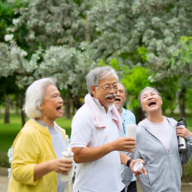 Group of seniors are exercising in public park. Senior lifestyle and healthcare.
