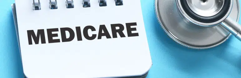 MEDICARE word in office notebook.