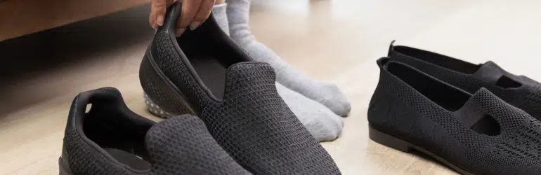 Elderly woman put on and take off shoes at home