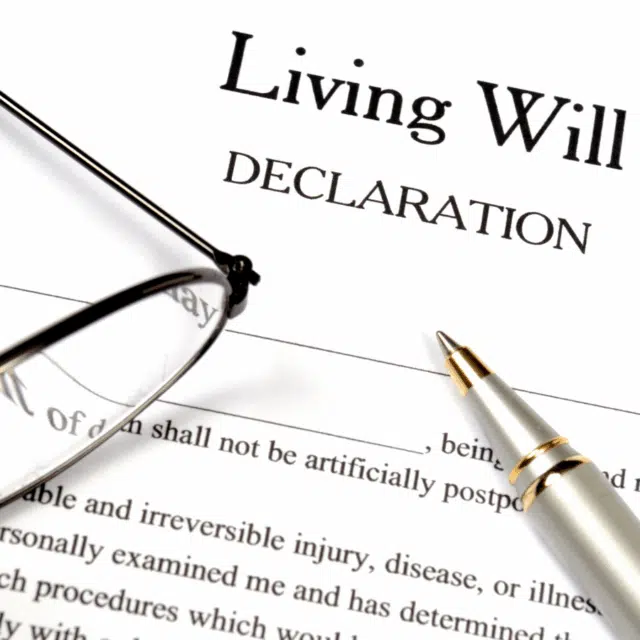 What is End of Life Planning and Why is It Important? Feature Image: A pair of glasses and pen lying on legal papers