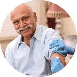 Man getting an injection from his primary care doctor