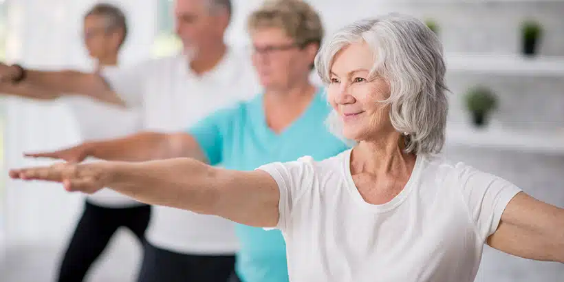 Older woman practicing Tai Chi
