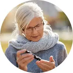 Woman doing blood test as part of her chronic disease management