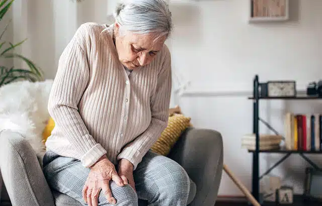 Woman trying to manage arthritis in the knee